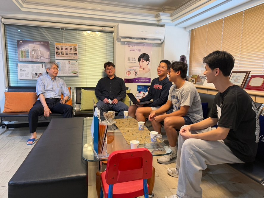 The Varuna team seated in a meeting with Dr. Tsai